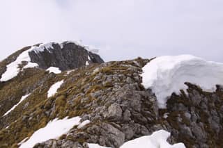 The summit ridge of Hajla with a late-spring snow cornice on the Kosovo–Montenegro border