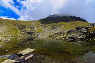The summit of Gjeravica, 2,656 m, the highest peak of Kosovo, rising above its glacial lake
