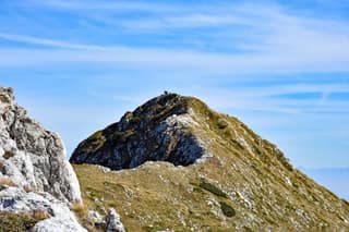 The rocky summit ridge of Hajla under a clear autumn sky, on the border above Rugova
