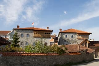 The restored stone kulla of Brahim Hoxha in Junik with its wooden divanhane and tiled roofs